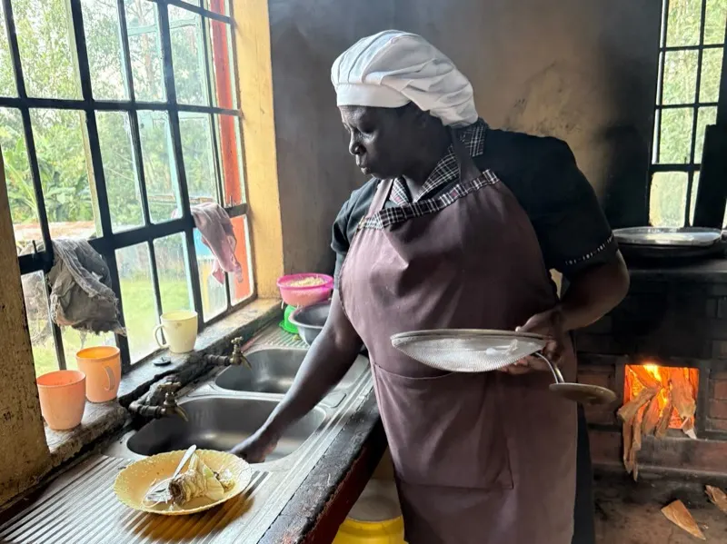 A house mother cooking in the children's home kitchen